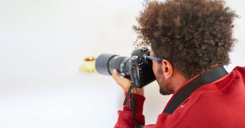 man taking photo of an item to sell online