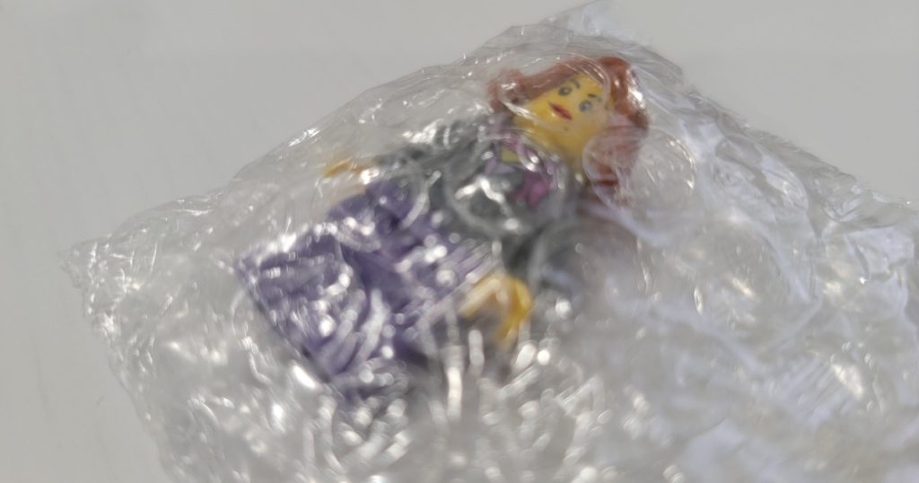 minifigure wrapped in a small clear bubble bag