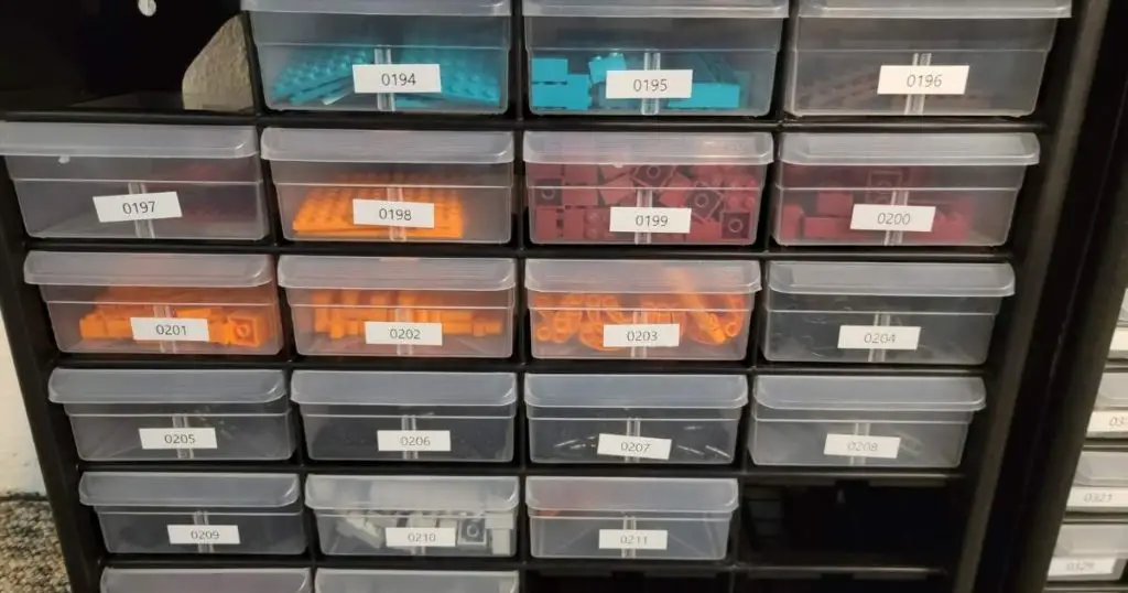 lego parts organized in transparent drawers